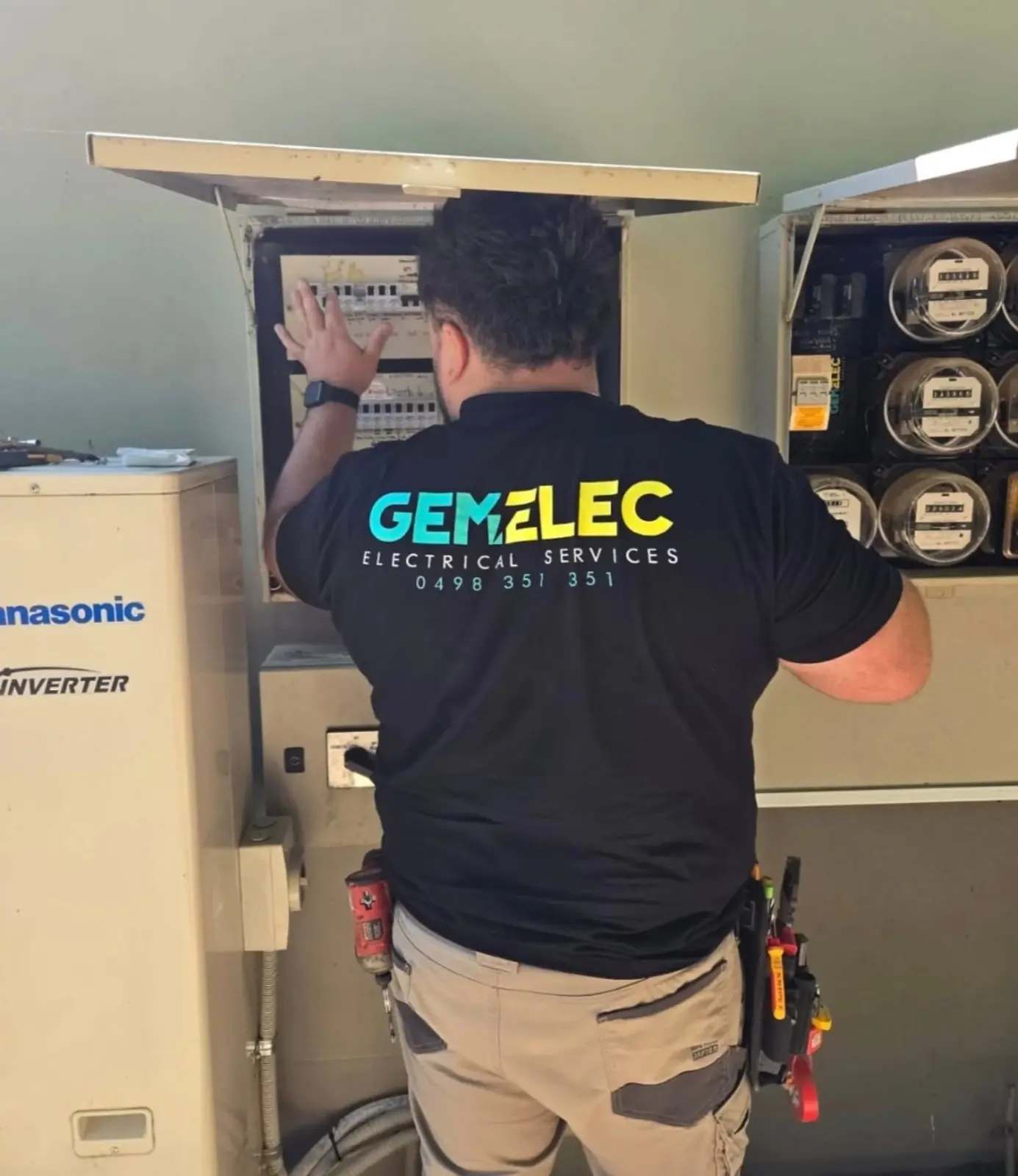 Mani installing a new switchboard in a Redfern terrace